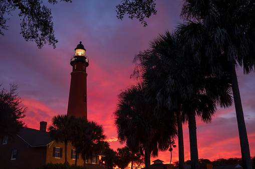 The Ponce de Leon Inlet Light, a lighthouse and museum located near Daytona Beach in central Florida, glows during a morning sunrise. At 175 feet in height, it is the tallest lighthouse in the state and one of the tallest in the United States.