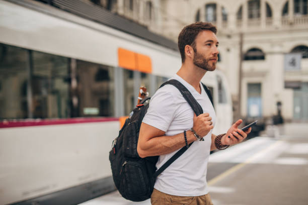 istock Charming man on train station in city 1197647562