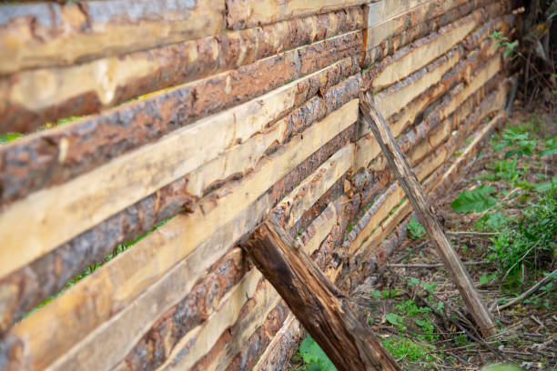 wooden fence with a support on the ground in the countryside wooden fence with a support on the ground in the countryside roughhewn stock pictures, royalty-free photos & images