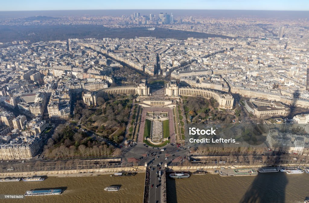 Panoramic view of Paris from Eiffel tower. Panoramic view of Paris from Eiffel tower towards the Jardins du Trocadero, the skytowers of Courbevoie in the background. Above Stock Photo