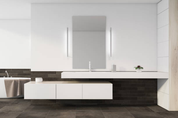 istock Sink and tub in white and gray tile bathroom 1197654023