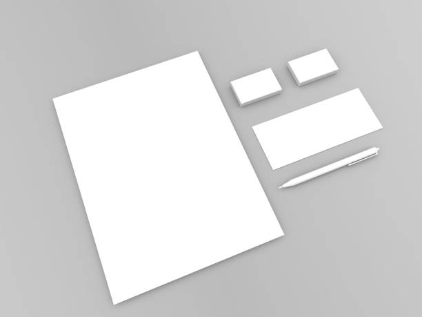 istock A4 sheet and business cards against gray background. 1197654319