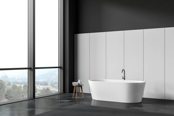 istock Black and white bathroom corner with tub 1197655488