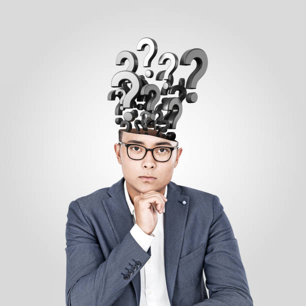 istock Asian businessman with many questions 1197655865