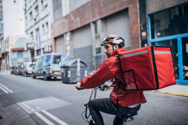 istock Delivery man on bicycle in city 1197656742