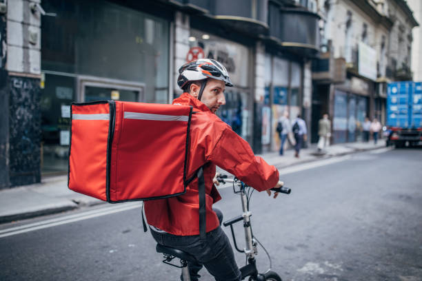 istock Delivery boy on bicycle in city 1197656757