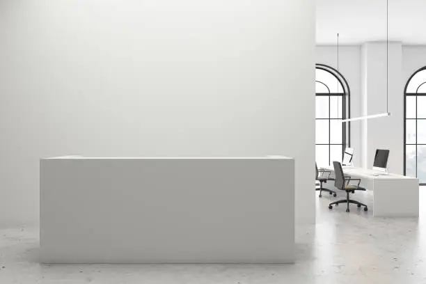 Interior of stylish open space office with white walls, concrete floor, comfortable white reception counter and long computer table near arched window. 3d rendering