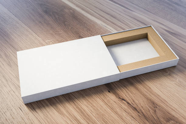 istock Open white cardboard box on wooden table 1197657797