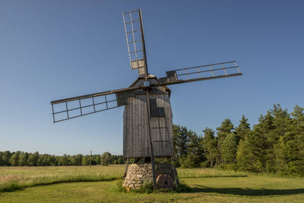 istock Grain mill on the summer landscape. Windmill and natural background pattern. Hiiumaa, small island in Estonia. Europe 1197657962