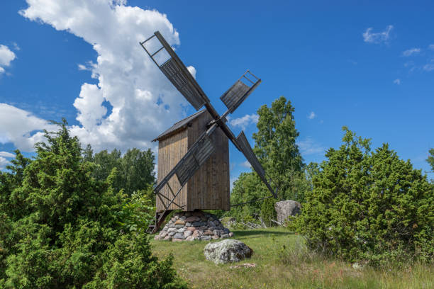 istock Grain mill on the summer landscape. Windmill and natural background pattern. Hiiumaa, small island in Estonia. Europe 1197658047