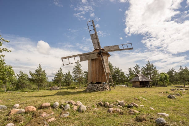 istock Grain mill on the summer landscape. Windmill and natural background pattern. Hiiumaa, small island in Estonia. Europe 1197658259