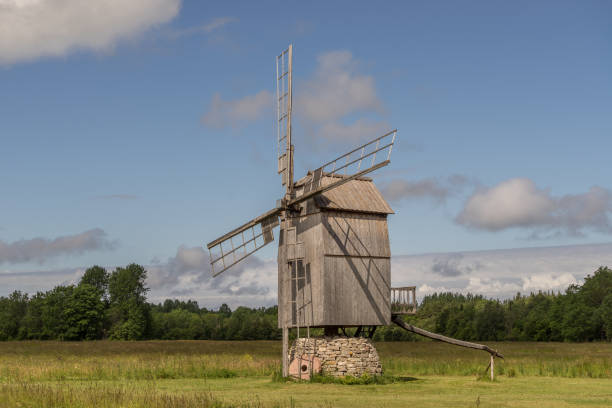 istock Grain mill on the summer landscape. Windmill and natural background pattern. Hiiumaa, small island in Estonia. Europe 1197658422