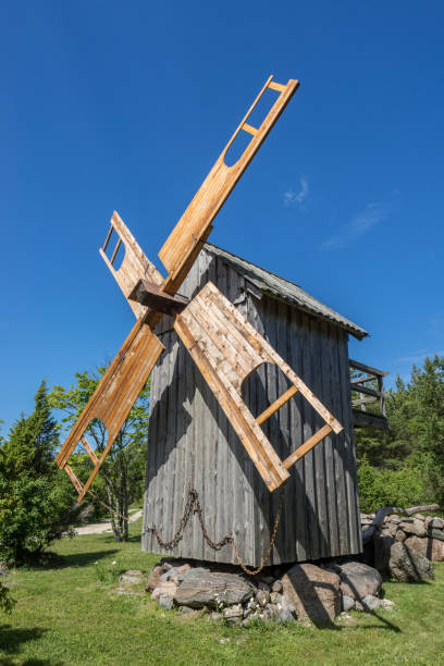 istock Grain mill on the summer landscape. Windmill and natural background pattern. Hiiumaa, small island in Estonia. Europe 1197658489