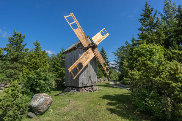 Grain mill on the summer landscape. Windmill and natural background pattern. Hiiumaa, small island in Estonia. Europe
