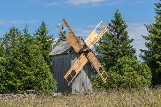 istock Grain mill on the summer landscape. Windmill and natural background pattern. Hiiumaa, small island in Estonia. Europe 1197659026