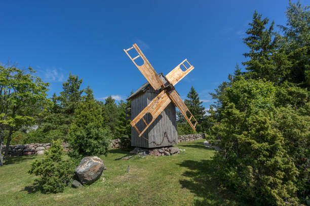 istock Grain mill on the summer landscape. Windmill and natural background pattern. Hiiumaa, small island in Estonia. Europe 1197659034