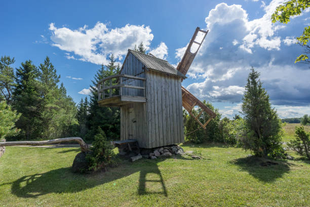 istock Grain mill on the summer landscape. Windmill and natural background pattern. Hiiumaa, small island in Estonia. Europe 1197659185