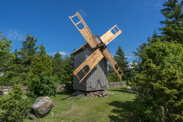 istock Grain mill on the summer landscape. Windmill and natural background pattern. Hiiumaa, small island in Estonia. Europe 1197659201