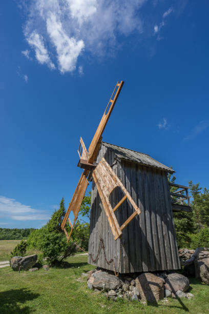 istock Grain mill on the summer landscape. Windmill and natural background pattern. Hiiumaa, small island in Estonia. Europe 1197659243