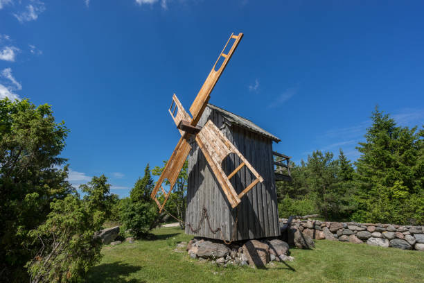 istock Grain mill on the summer landscape. Windmill and natural background pattern. Hiiumaa, small island in Estonia. Europe 1197659262