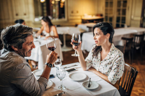 istock Couple drinking wine in restaurant 1197659446