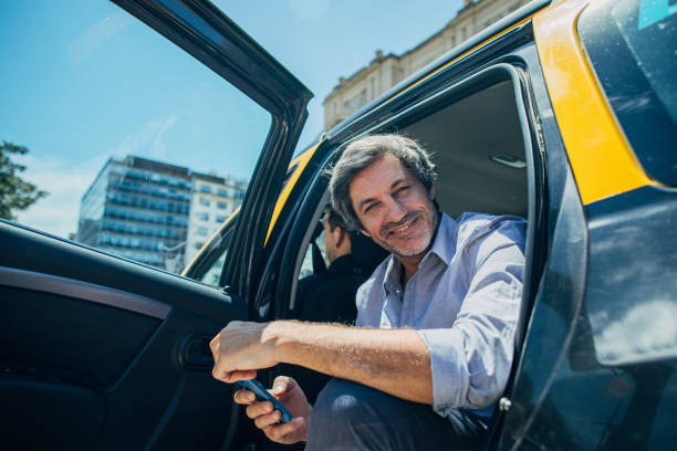 istock Mature man sitting in backseat of a cab 1197659789
