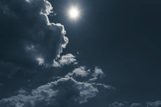 istock dark sky with cloudscape and sun for backgrounds 1197659975