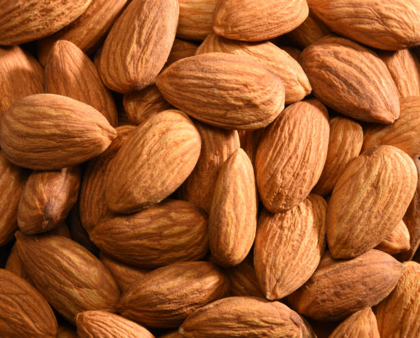 istock Close-up group of almonds background 1197660897