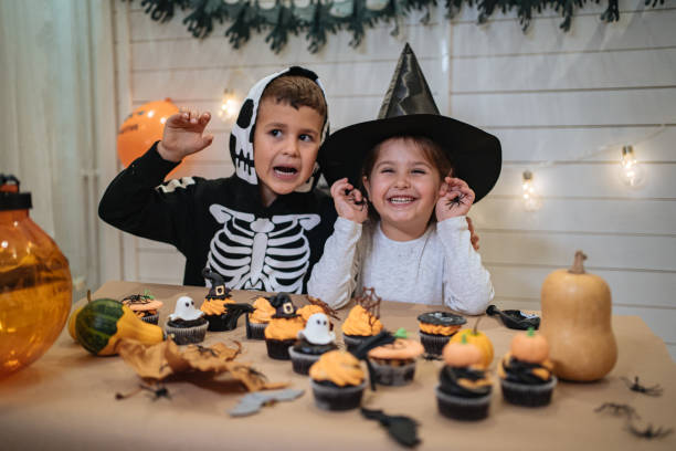 istock Spooky Halloween for young siblings at home 1197663800