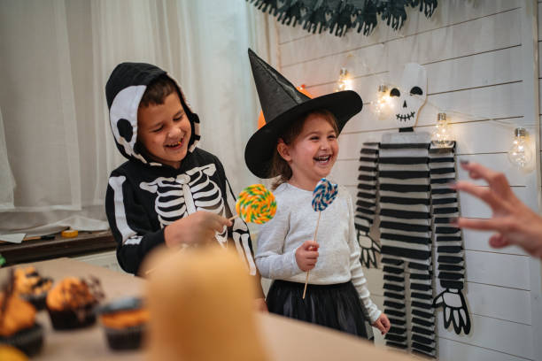 istock Children being scared by their parent on Halloween 1197663922