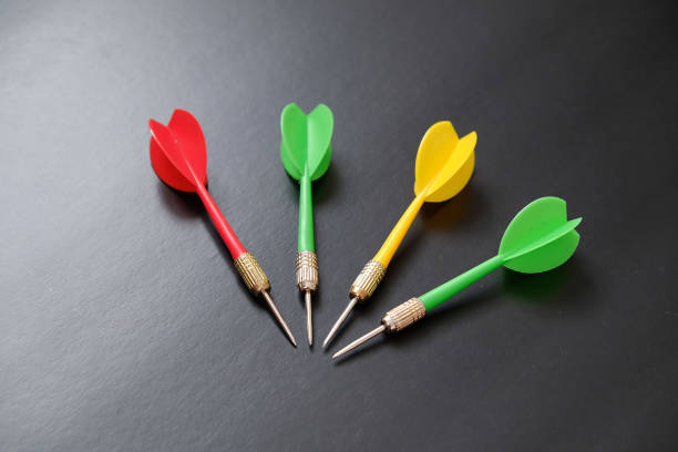 istock red, yellow, green dart arrows on black background, 1197664623
