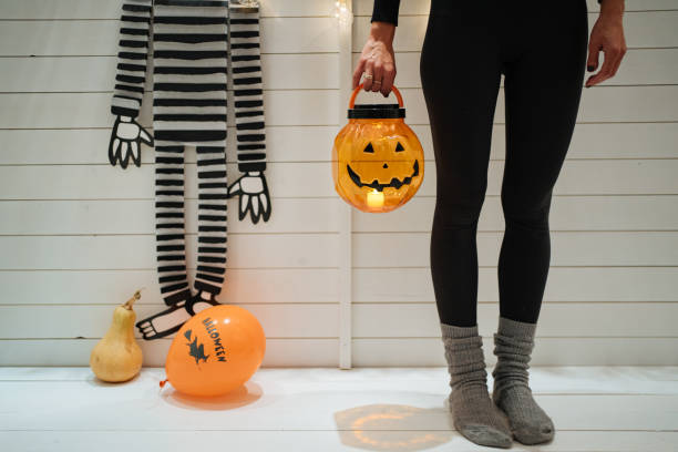 istock Young woman going trick or treating 1197664769