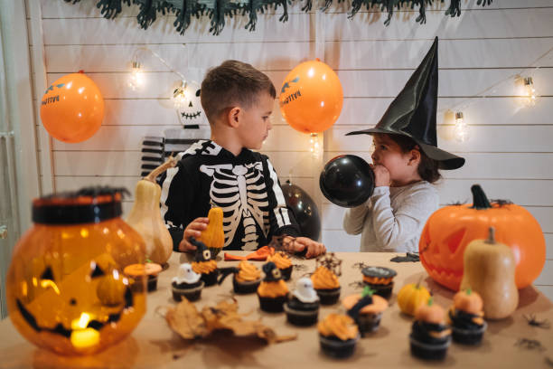 istock Brother and sister celebrating Halloween 1197664830