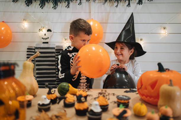 istock Cheerful siblings preparing for Halloween 1197664872