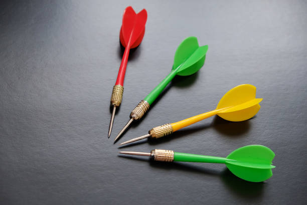 istock red, yellow, green dart arrows on black background, 1197666159
