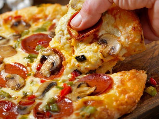 istock Taking the First Piece of Pizza 1197669201