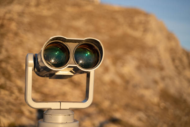 istock Enjoyment Outdoors on a Sunny Day. Travel destinations. A sightseeing telescope, panoramic binocular. 1197669210