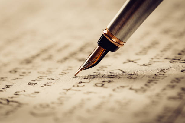 istock Fountain pen on an ancient handwritten letter. Old story. Retro style. 1197669358