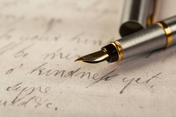 istock Fountain pen on an ancient handwritten letter. Old story. Retro style. 1197669373