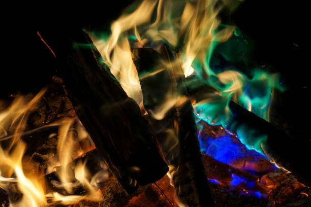 istock Burning campfire with colourful flames at night 1197669415