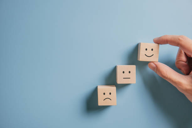 istock Customer showing rating with happy icon on blue background, Customer satisfaction survey concept. 1197672772