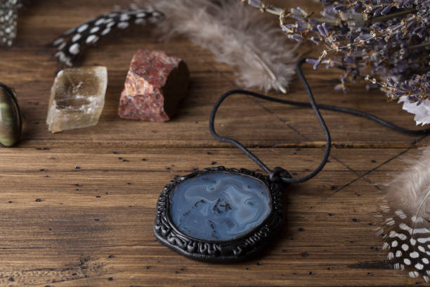 istock Divination with lavender, amulet, stones, feathers Halloween background, occult and esoteric objects 1197672938