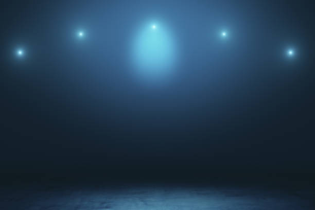 istock Abstract empty space with blurry spotlights and dark concrete floor. 1197675404