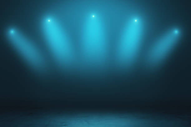 istock Abstract empty stage with smoky spotlights and concrete floor in dark space room. 1197677290