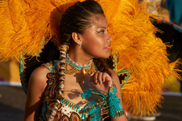 Arica, Chile - February 10, 2017: Female member of a Tobas dance group in ornate costume performing at the annual Carnaval Andino con la Fuerza del Sol in Arica, Chile.