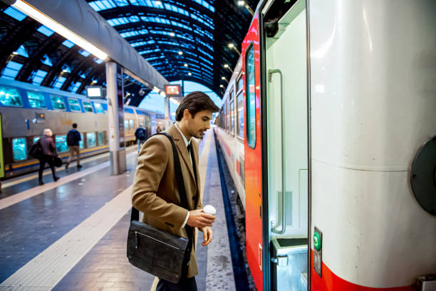 istock Modern gentleman going for travel by train 1197682594