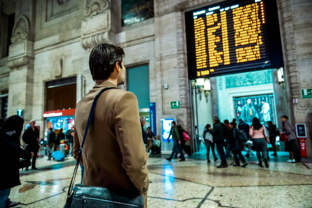 istock Young businessman at the train station 1197683747
