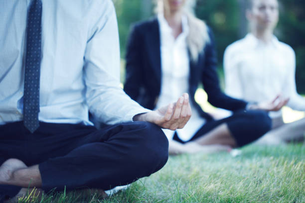 istock Business people practicing yoga 1197683812