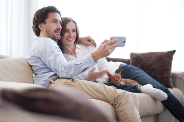 istock Happy couple taking selfie 1197683844