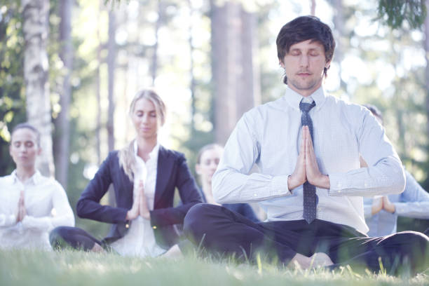 istock Business people practicing yoga 1197683862